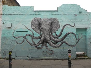 <b>Author:</b> duncan cumming<br>
<b>License:</b> <a href="https://creativecommons.org/licenses/by-nc/2.0/" target="_blank" rel="noopener">CC BY-NC 2.0</a> Alexis Diaz street art Shoreditch Flickr duncan cumming CC BY NC 2 0